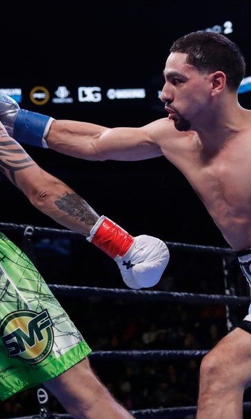 Garcia earns 12-round decision, overcomes bite by Redkach